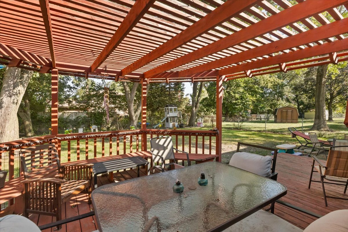 1246 Thomas Street Homewood, IL 60430 - Photo 25 of 29 a view of a patio with a table chairs and a backyard