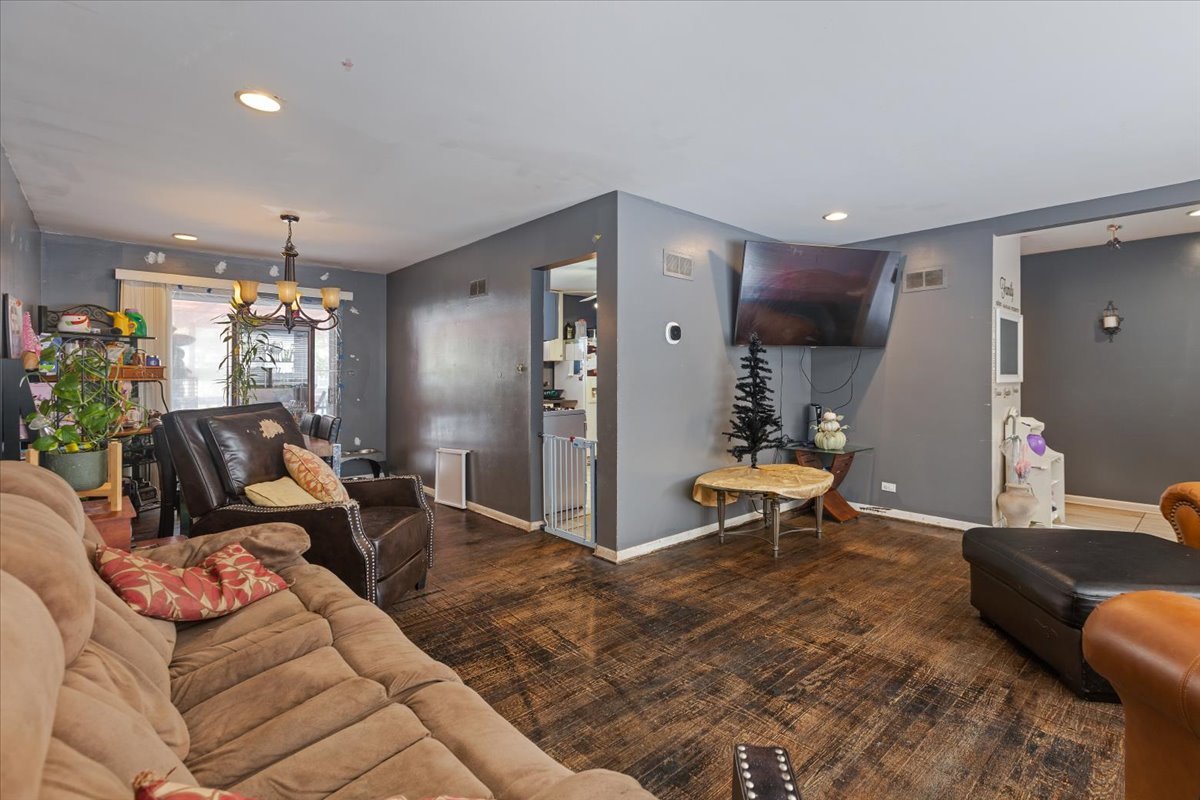 1246 Thomas Street Homewood, IL 60430 - Photo 4 of 29 a living room with furniture and a chandelier