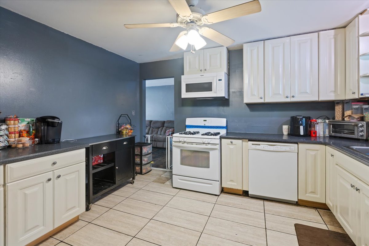 1246 Thomas Street Homewood, IL 60430 - Photo 8 of 29 a kitchen with white cabinets and white appliances