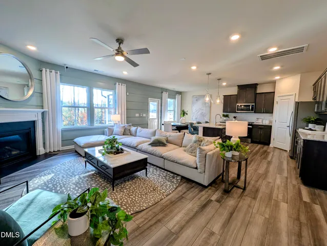a living room with furniture fireplace and a flat screen tv