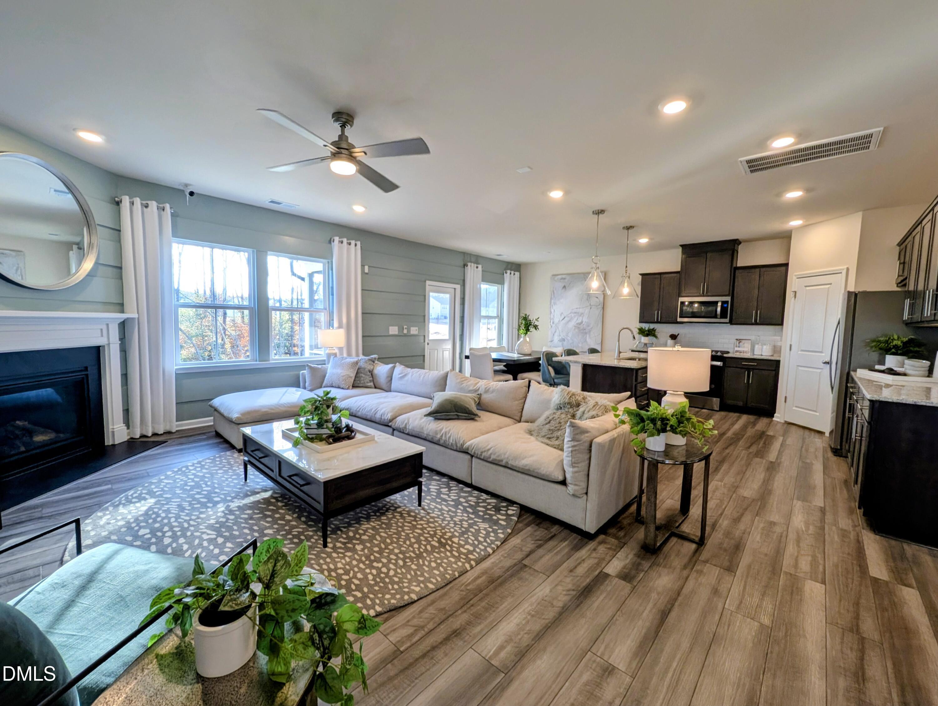 a living room with furniture fireplace and a flat screen tv