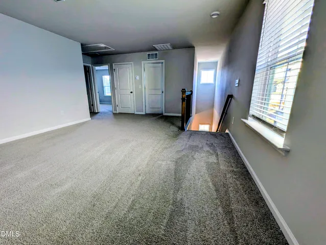a bathroom with a shower and a window