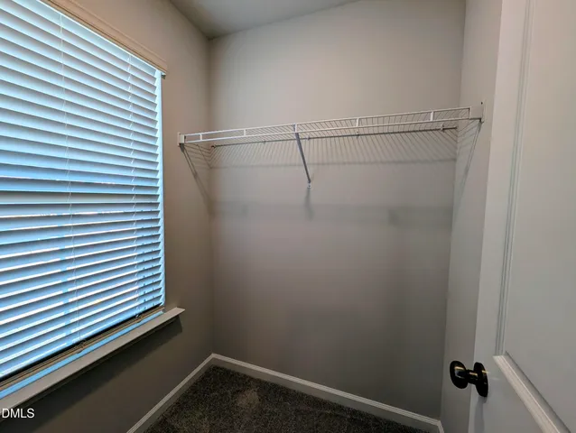 a bedroom with a bed and a tv in it