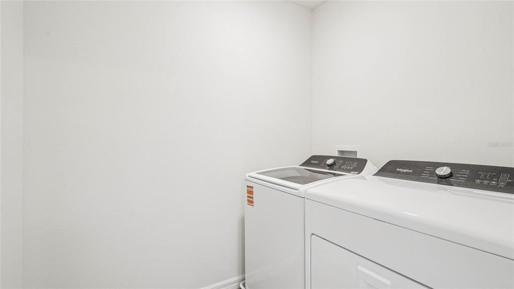 4615 Southwest 88 Place Ocala, FL 34476 - Photo 13 of 16 a utility room with dryer and washer