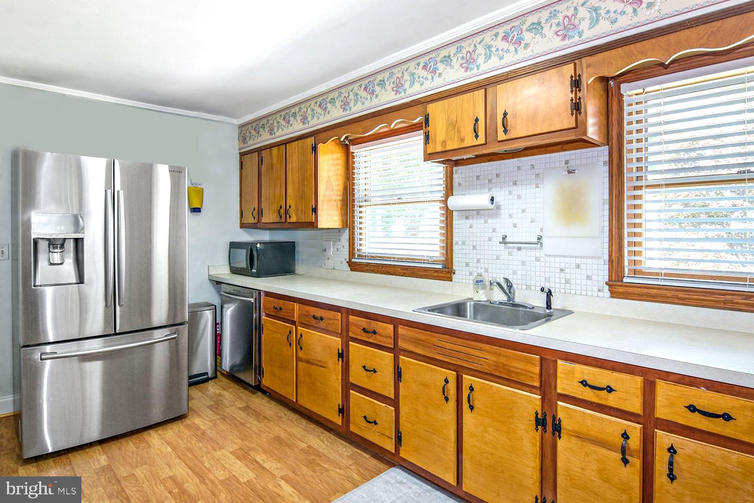 8479 Sexton Road Pasadena, MD 21122 - Photo 16 of 35 Inlaid Tile Backsplash . Lots of Counter Space