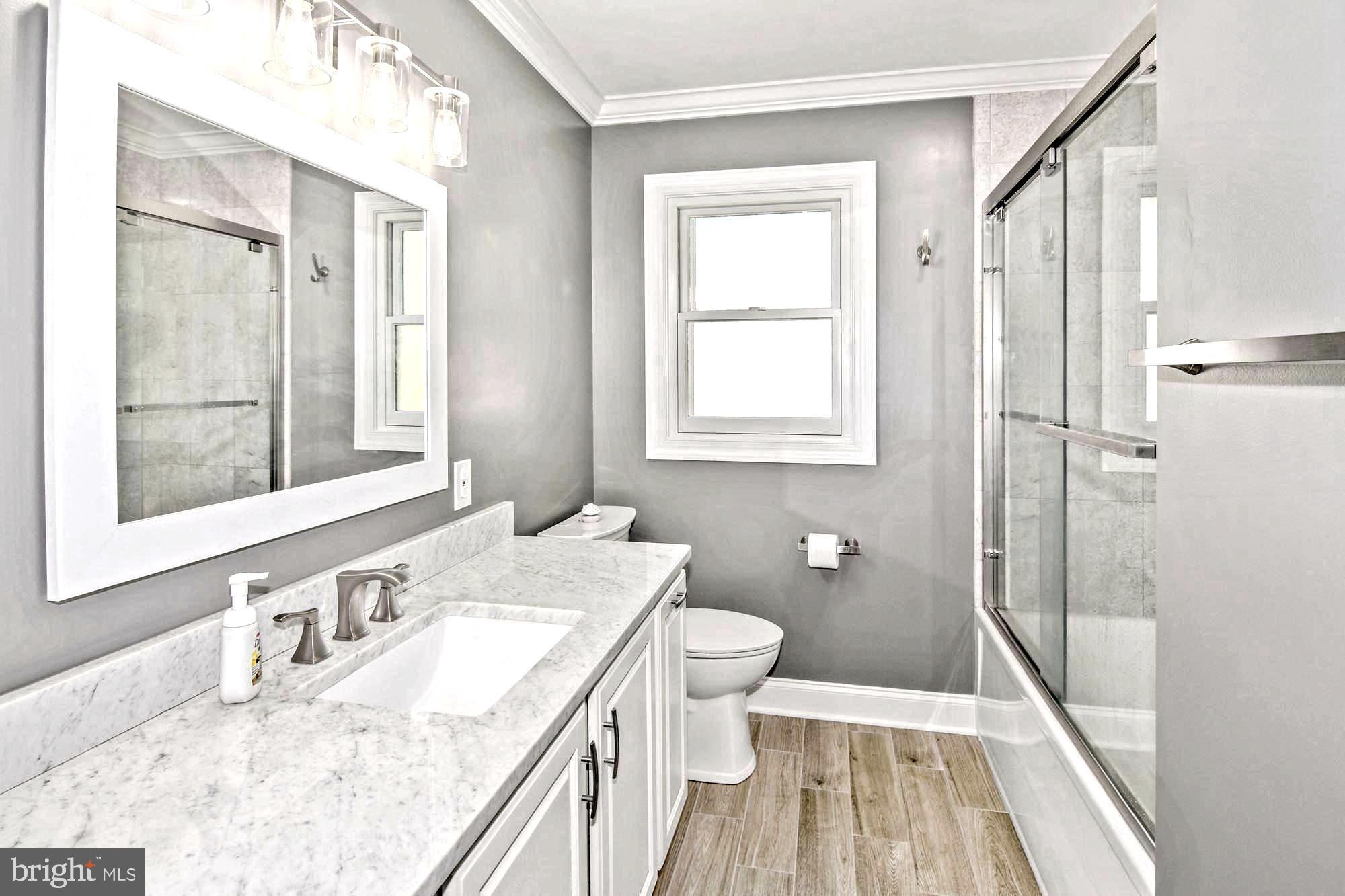 8479 Sexton Road Pasadena, MD 21122 - Photo 25 of 35 Mirrored Marble-Topped Vanity
