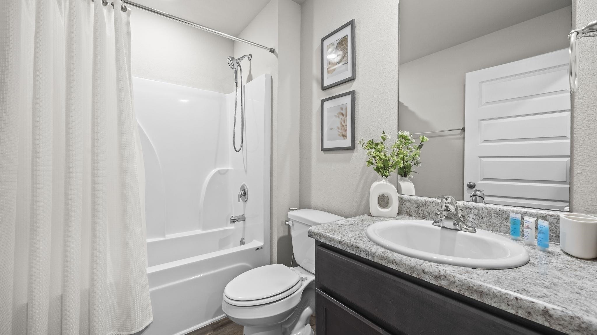 224 Burnston Way Foley, AL 36535 - Photo 22 of 42 Full bathroom with shower / tub combo with curtain, vanity, and a textured wall