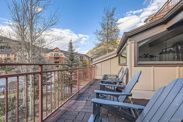 a view of a balcony with chairs