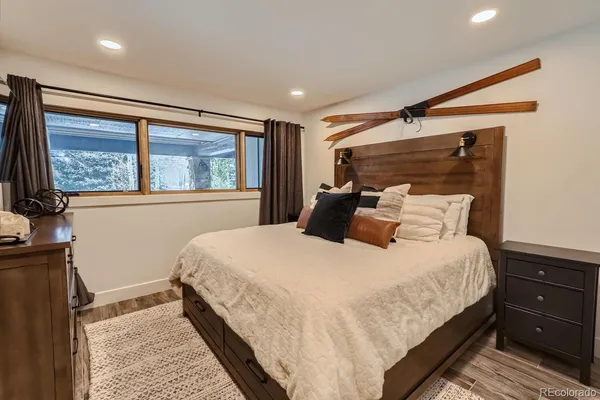 a bedroom with bed and window