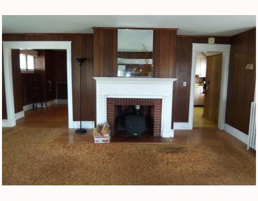 211 West Main Road Middletown, RI 02842 - Photo 2 of 3 Living Room. Fireplace, dorr to kit and dining