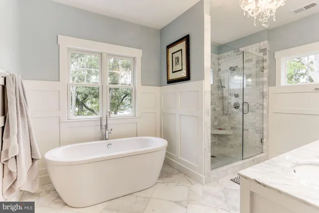 a bathroom with a bathtub and shower