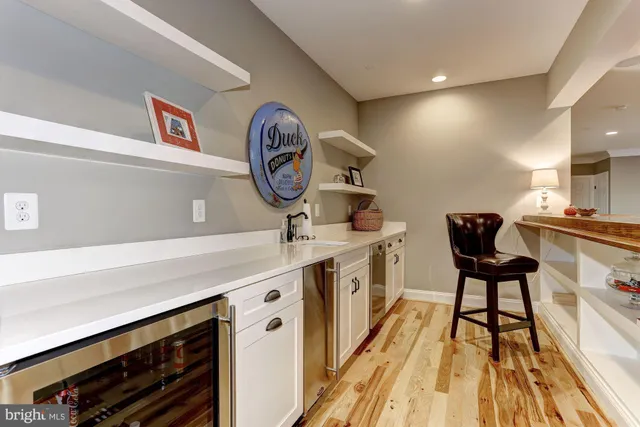 a view of a kitchen with a table and a chair