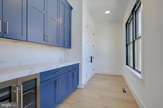 a view of a kitchen with cabinets