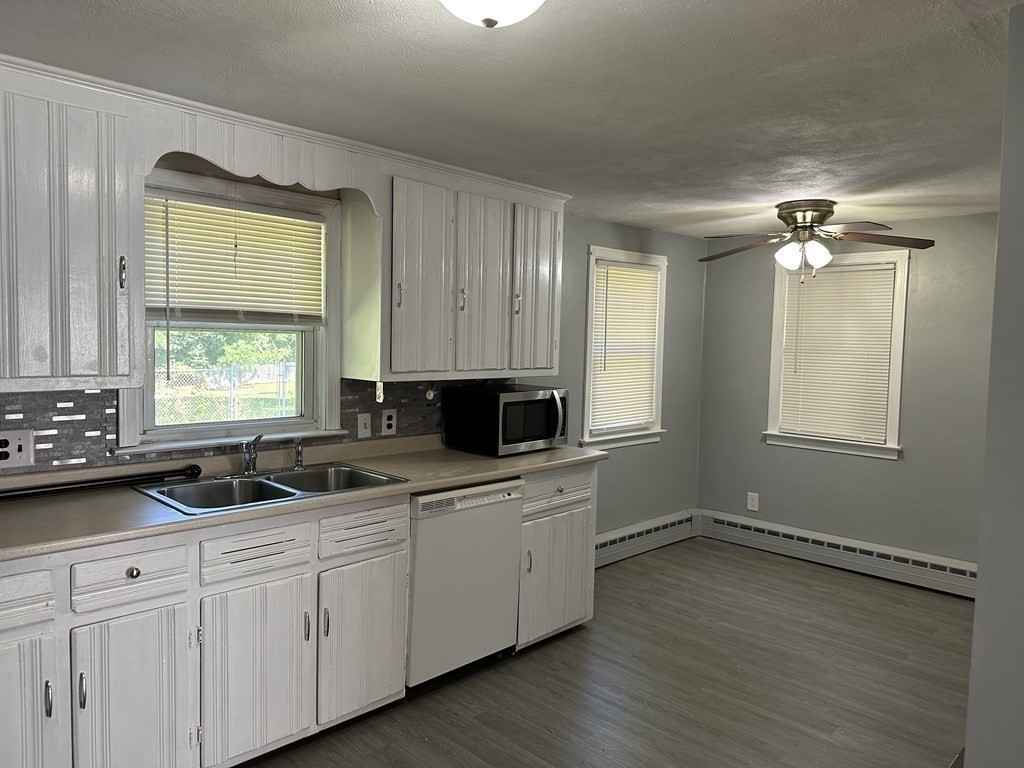 54 Fernald Street Springfield, MA 01109 - Photo 4 of 13 a kitchen with a sink and cabinets