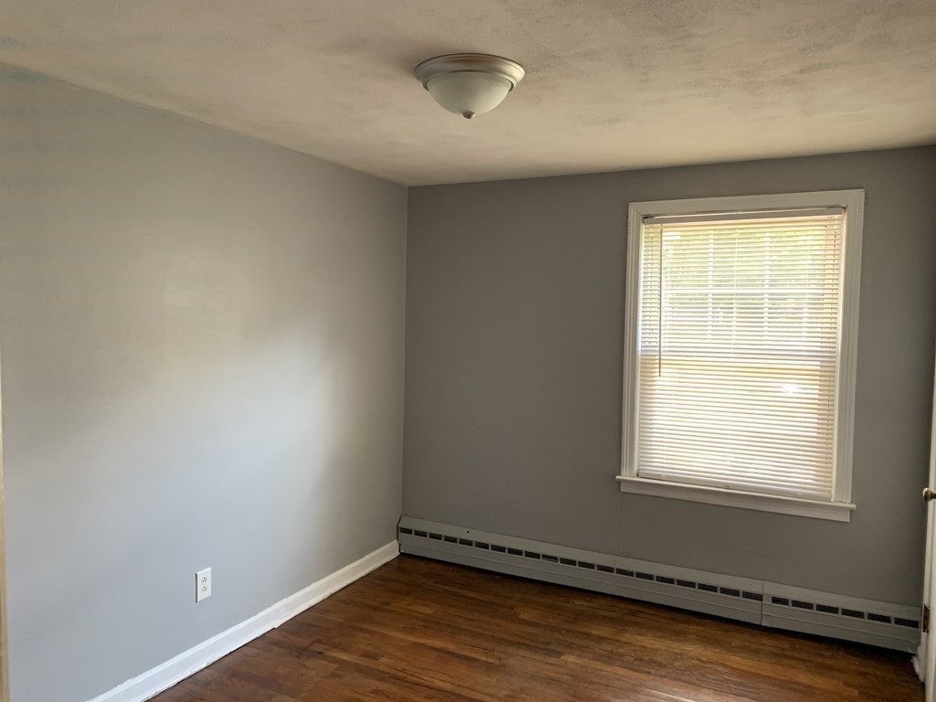 54 Fernald Street Springfield, MA 01109 - Photo 9 of 13 an empty room with a window