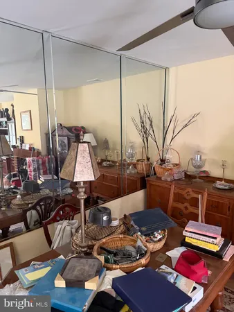 a living room with furniture and a lamp