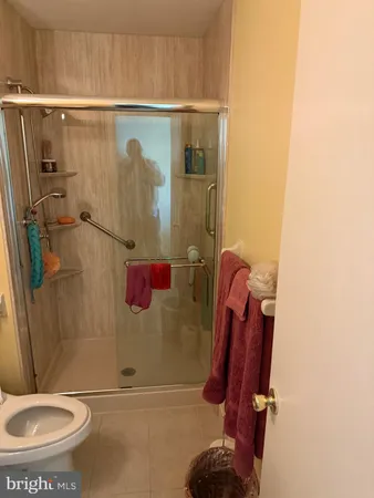 a bathroom with a shower and a toilet