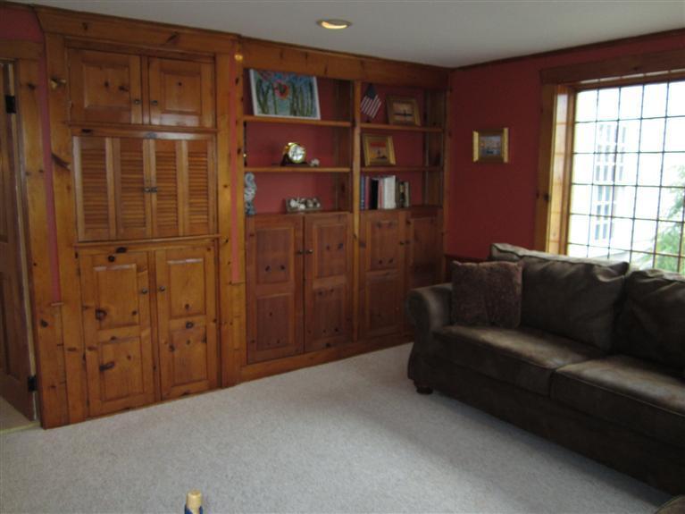 65 Bone Hill Road Barnstable, MA 02675 - Photo 11 of 34 a living room with furniture a closet and a window