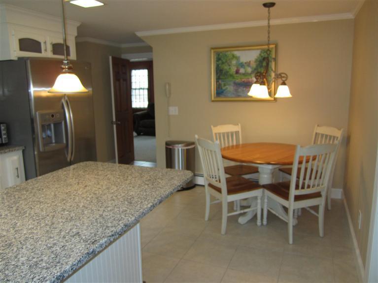 65 Bone Hill Road Barnstable, MA 02675 - Photo 15 of 34 a dining room with a table and chairs