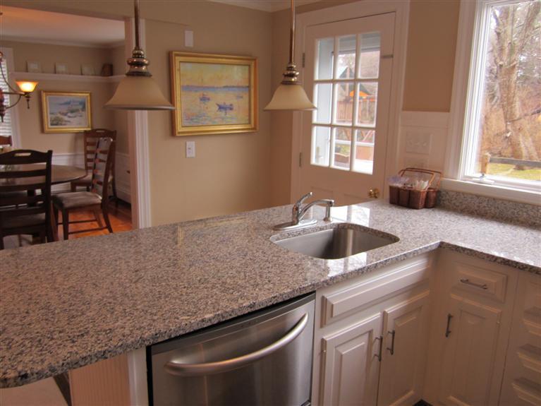 65 Bone Hill Road Barnstable, MA 02675 - Photo 18 of 34 a kitchen with granite countertop a sink a counter top space and cabinets