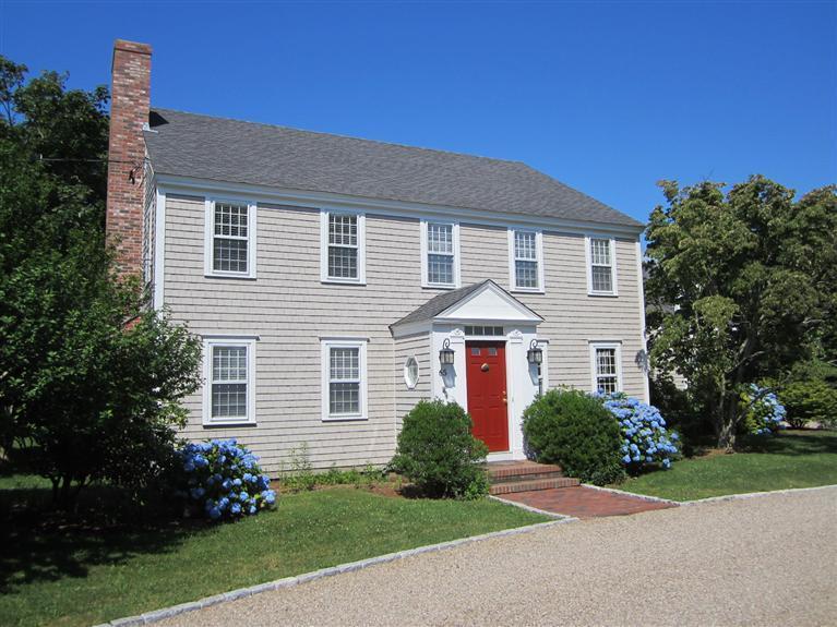 65 Bone Hill Road Barnstable, MA 02675 - Photo 2 of 34 a front view of a house with a garden