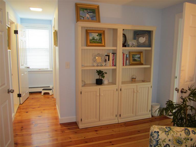 65 Bone Hill Road Barnstable, MA 02675 - Photo 23 of 34 a view of a livingroom with wooden floor and closet