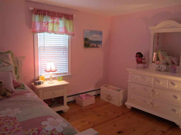 65 Bone Hill Road Barnstable, MA 02675 - Photo 30 of 34 a bedroom with a bed and a table chair