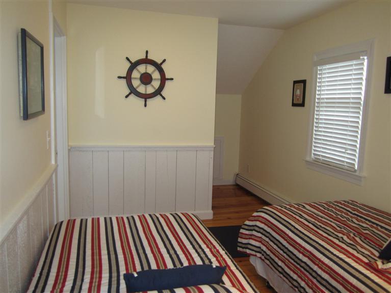 65 Bone Hill Road Barnstable, MA 02675 - Photo 33 of 34 a view of a room with wooden floor and fan