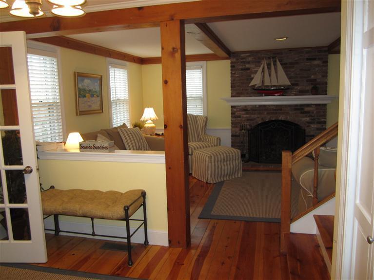 65 Bone Hill Road Barnstable, MA 02675 - Photo 5 of 34 a living room with furniture and a fireplace