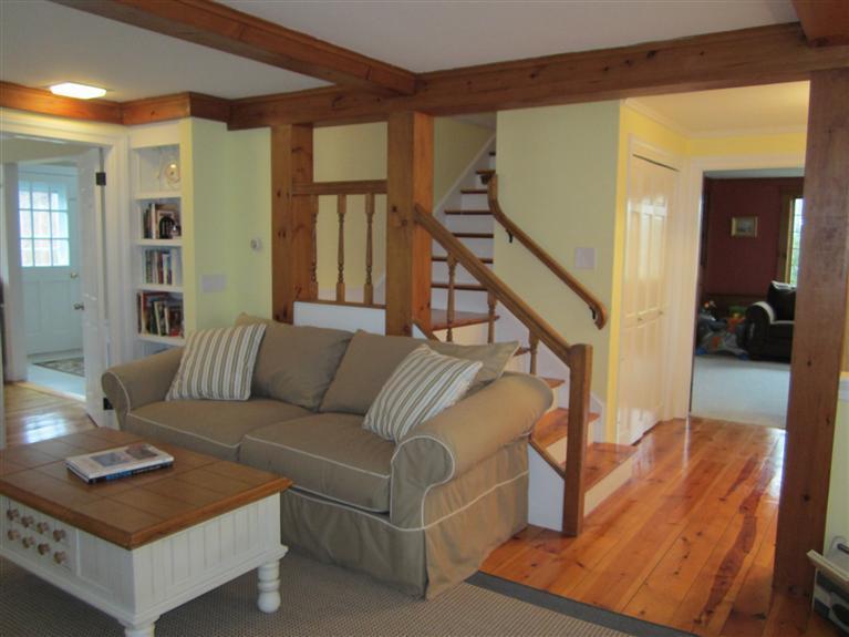 65 Bone Hill Road Barnstable, MA 02675 - Photo 6 of 34 a living room with furniture and a wooden floor