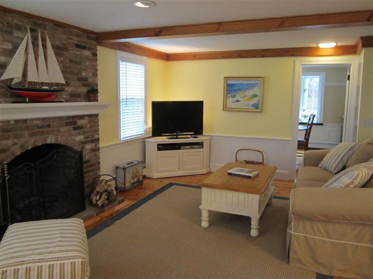 65 Bone Hill Road Barnstable, MA 02675 - Photo 7 of 34 a living room with furniture and a flat screen tv