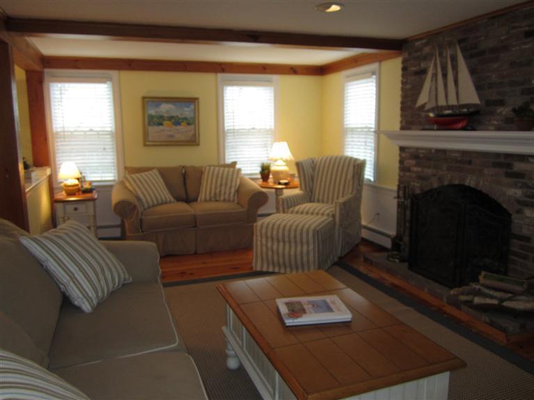 65 Bone Hill Road Barnstable, MA 02675 - Photo 8 of 34 a living room with furniture and a fireplace