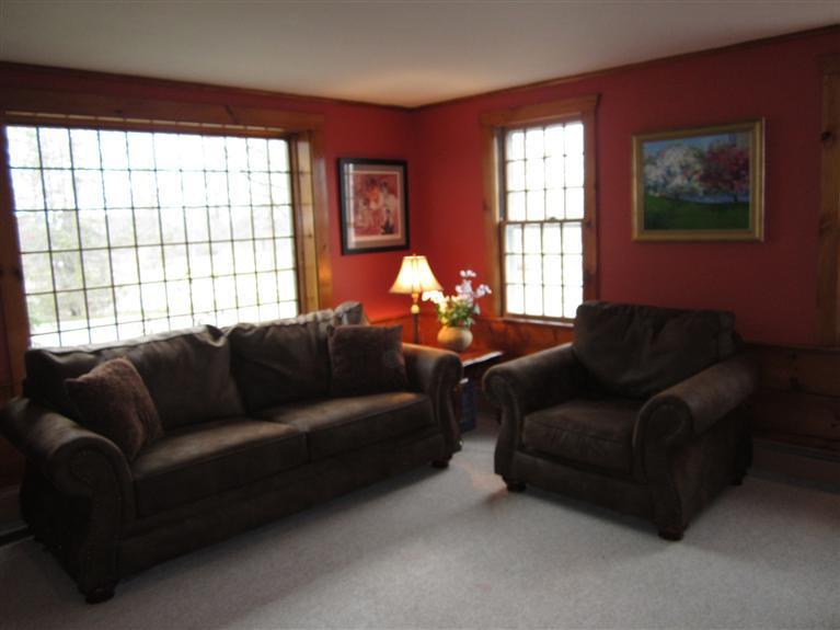 65 Bone Hill Road Barnstable, MA 02675 - Photo 9 of 34 a living room with furniture and a large window