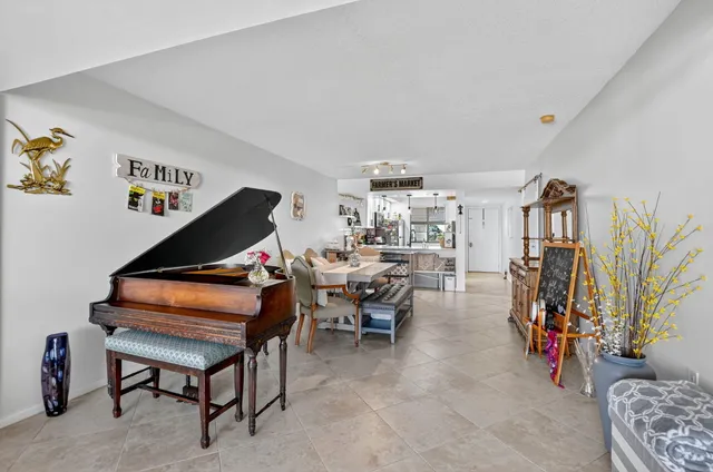 a living room with furniture and a gym