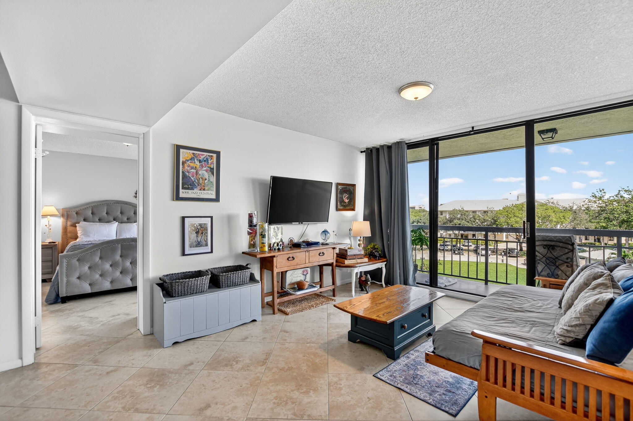 6205 Balboa Circle, Unit 403 Boca Raton, FL 33433 - Photo 9 of 41 a living room with furniture and large flat screen tv