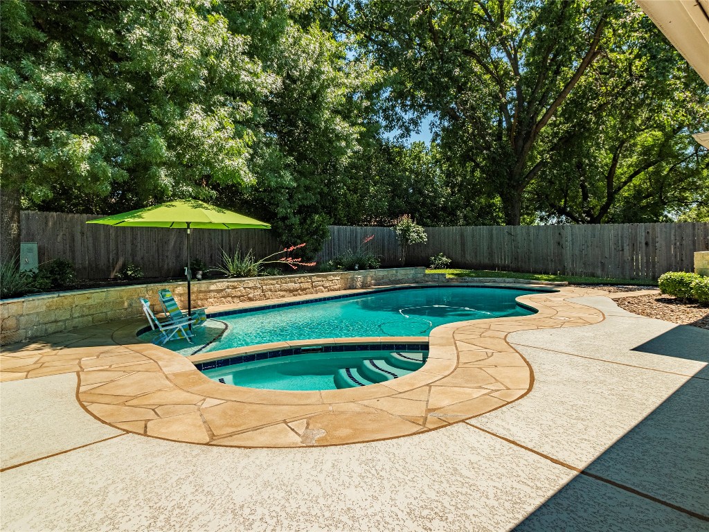 a swimming pool with an outdoor seating