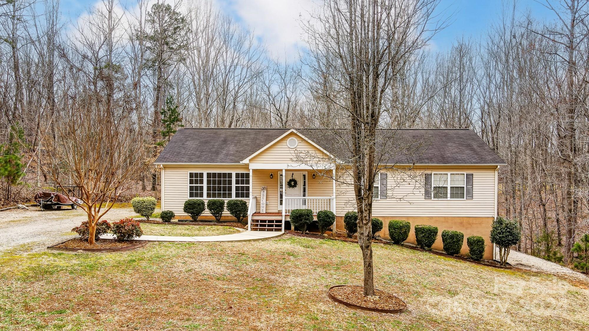 5312 Addison Road Waxhaw, NC 28173 - Photo 1 of 48 a front view of a house with a yard patio and fire pit