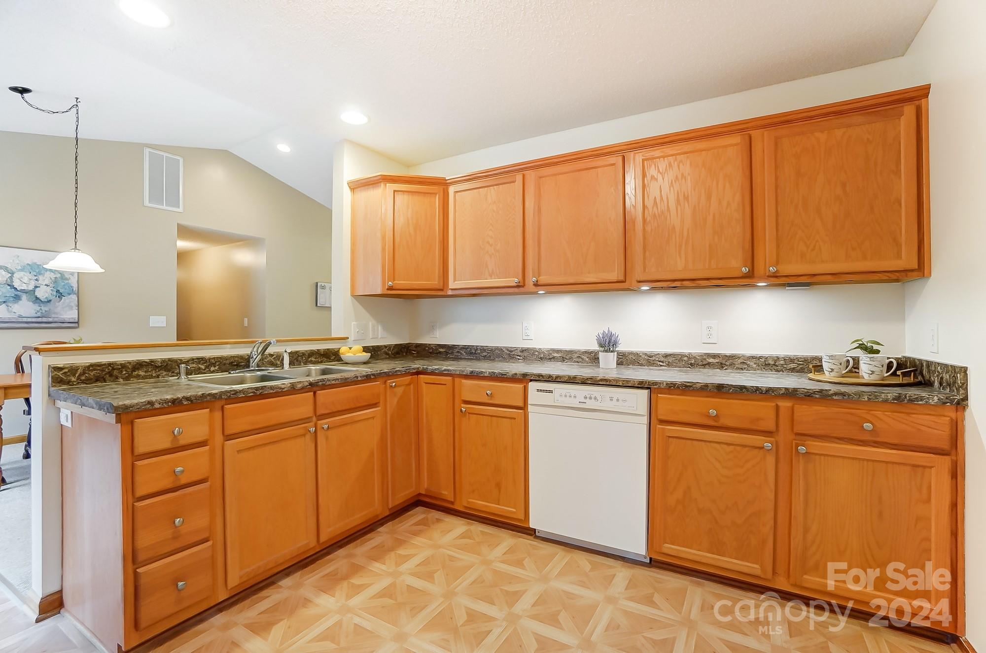 5312 Addison Road Waxhaw, NC 28173 - Photo 16 of 48 a kitchen with stainless steel appliances granite countertop a sink stove and cabinets