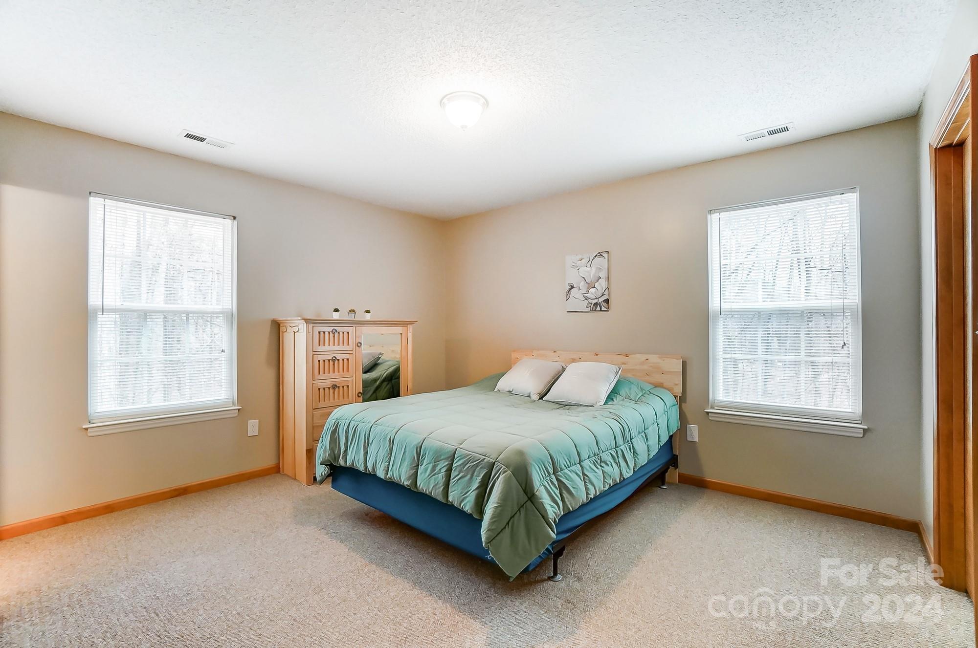 5312 Addison Road Waxhaw, NC 28173 - Photo 20 of 48 a bedroom with a bed lamp and window