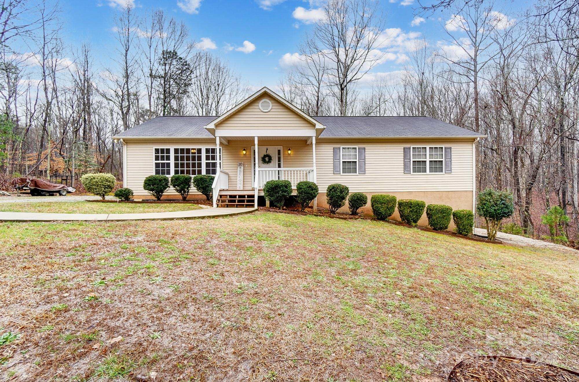 5312 Addison Road Waxhaw, NC 28173 - Photo 2 of 48 a front view of a house with a yard