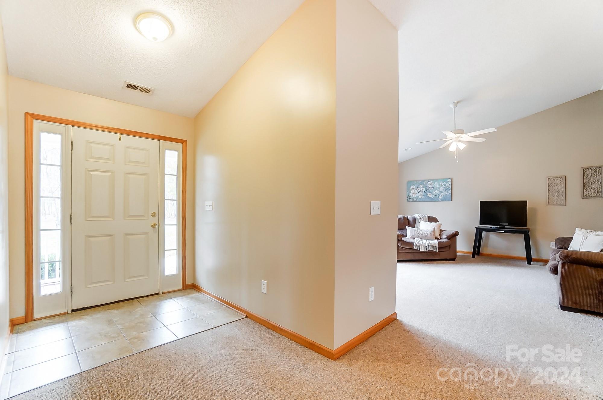 5312 Addison Road Waxhaw, NC 28173 - Photo 5 of 48 a view of a livingroom with furniture and a couch