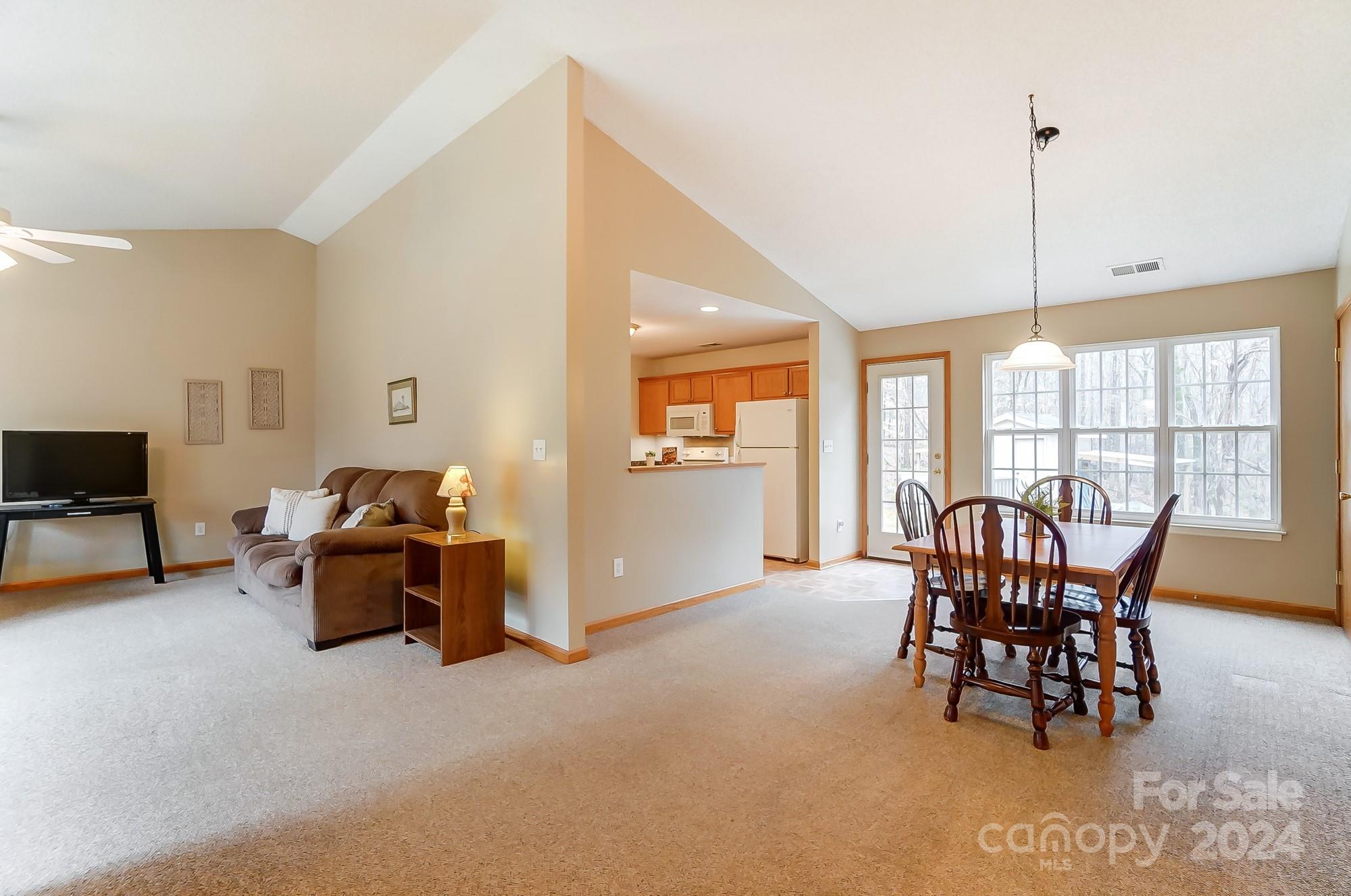5312 Addison Road Waxhaw, NC 28173 - Photo 10 of 48 a dining room with furniture and windows