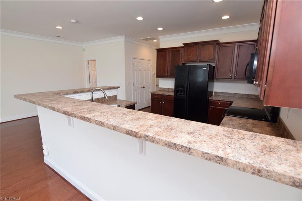 3476 Basalt Court High Point, NC 27265 - Photo 12 of 30 This long breakfast bar is perfect for additional seating!