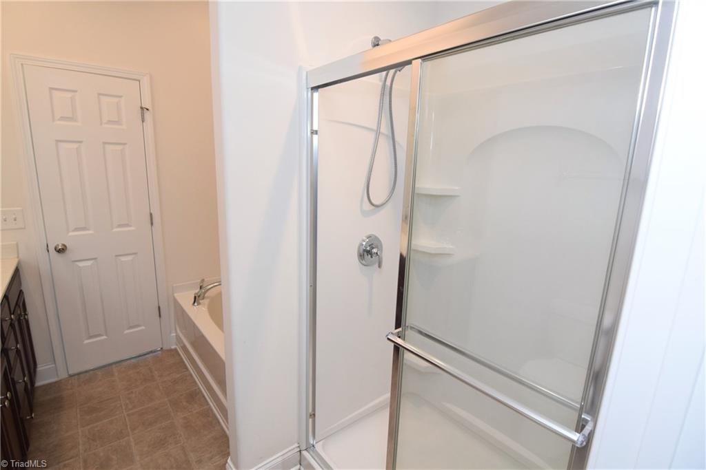 3476 Basalt Court High Point, NC 27265 - Photo 27 of 30 Relax in the large garden tub. The master bathroom also has a separate walk-in shower.