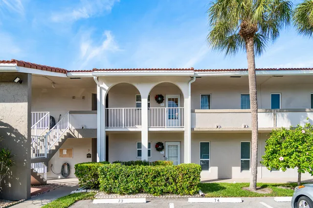 front view of a house with a garden