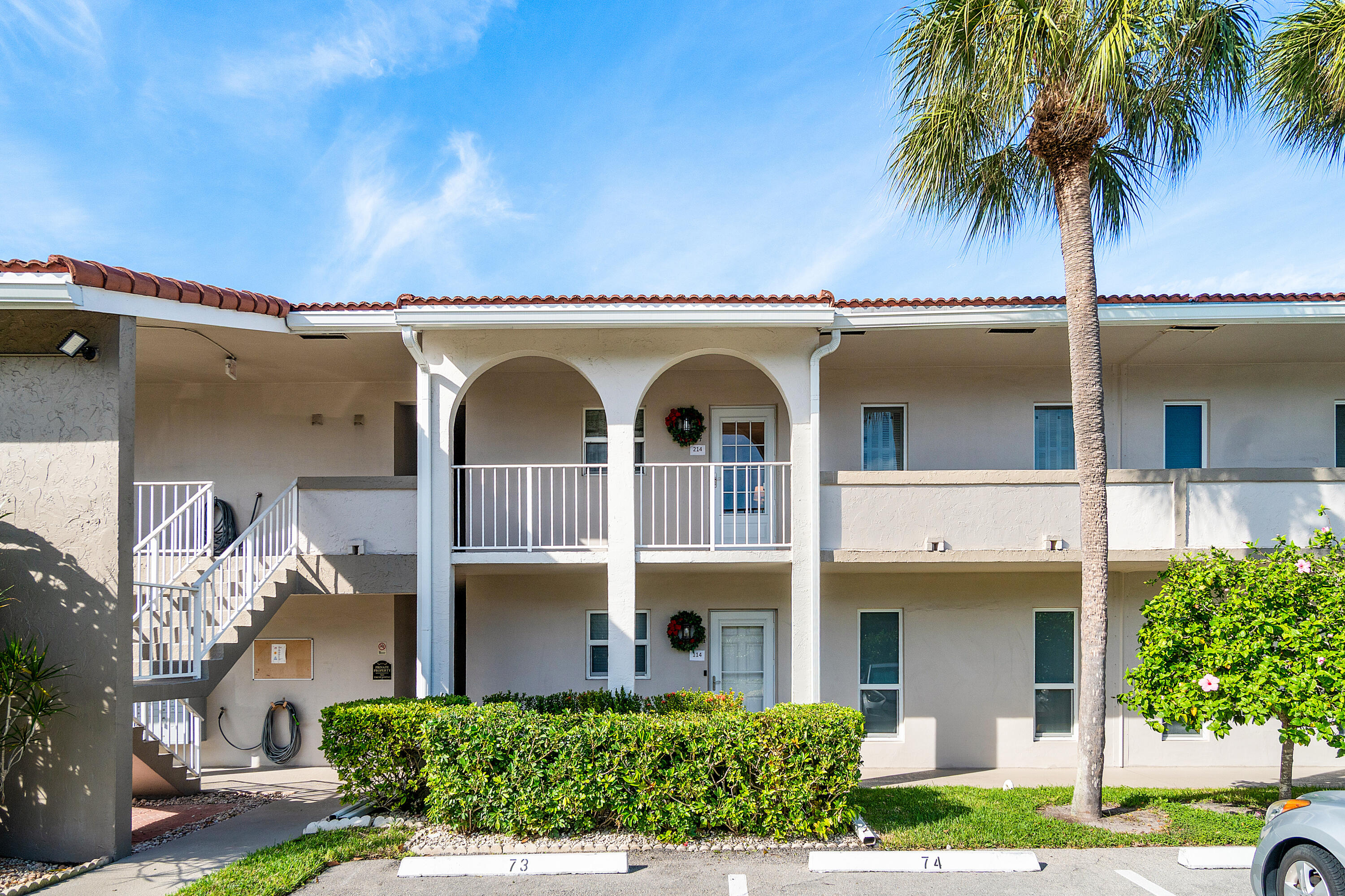 front view of a house with a garden