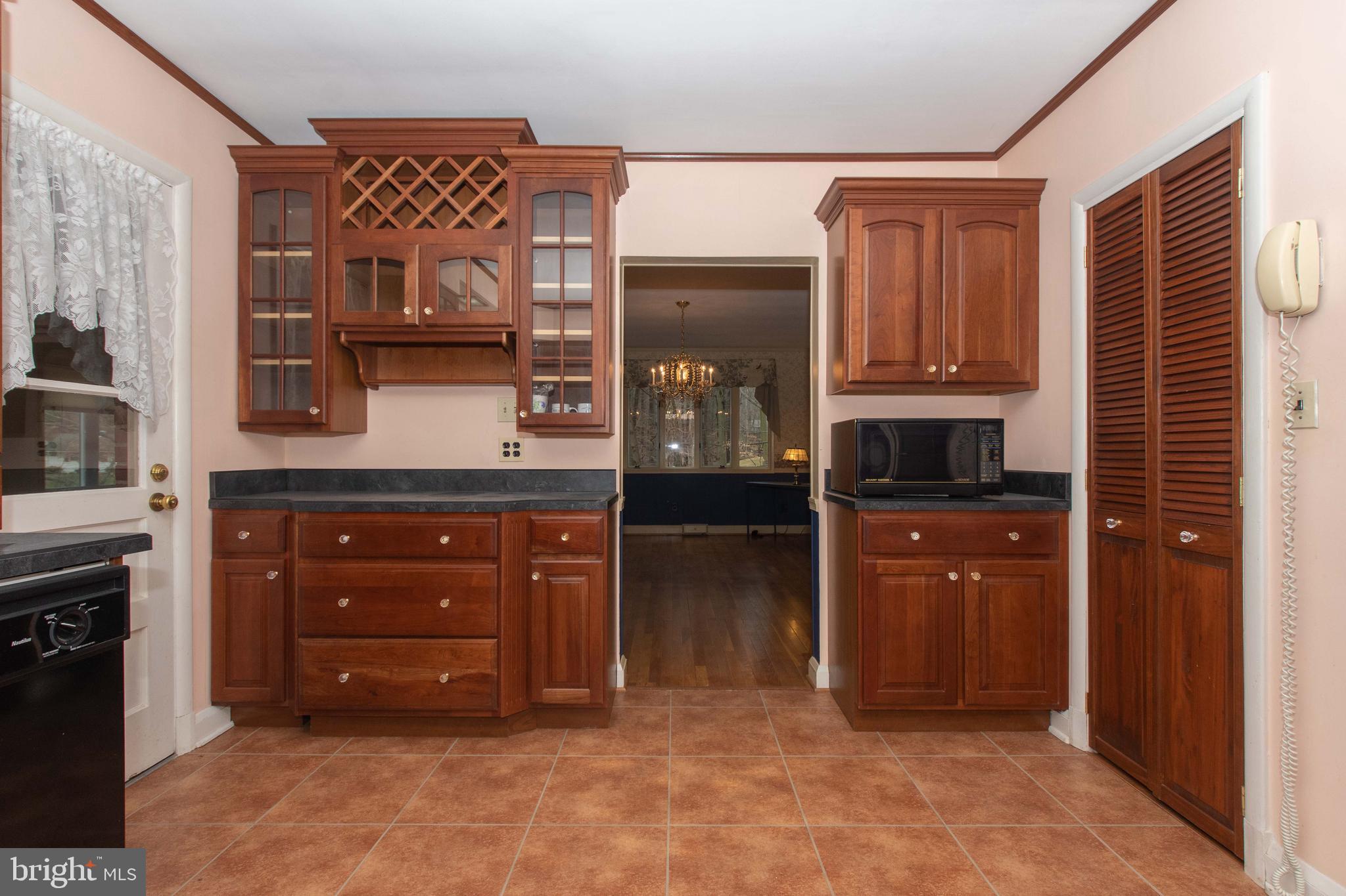 804 Stone Barn Road Towson, MD 21286 - Photo 3 of 40 Built in wine rack with rich Cherry Cabinetry