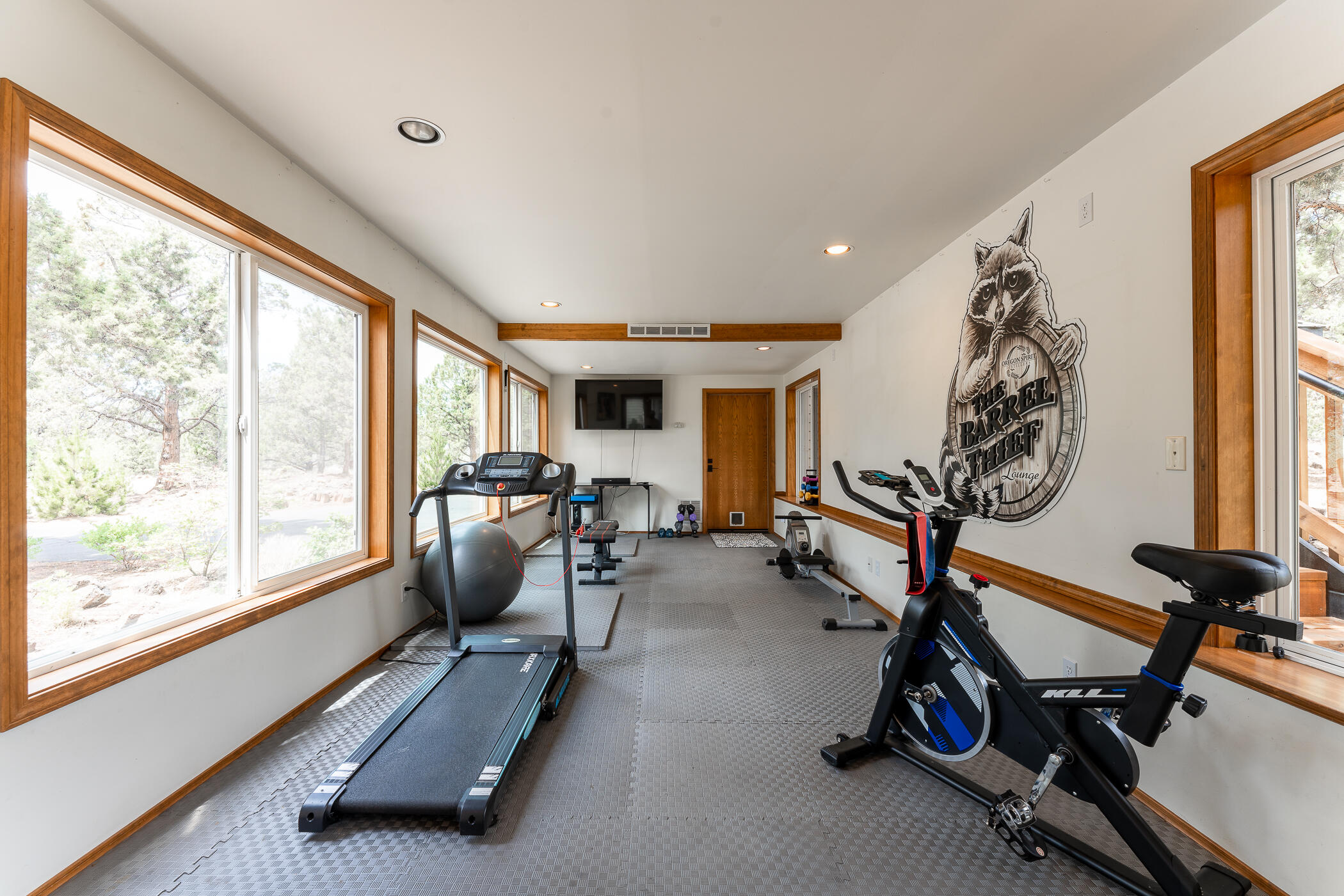 64300 Crosswinds Road Bend, OR 97703 - Photo 37 of 61 Breezeway connecting the living area to the additional oversized garage/workshop is currently used as a workout room.