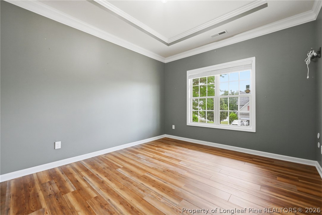 33 Colonist Place Cameron, NC 28326 - Photo 8 of 47 a view of an empty room with wooden floor and a window