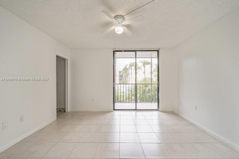 8540 Southwest 133rd Avenue Road, Unit 208 Miami, FL 33183 - Photo 12 of 18 a view of an empty room with a window